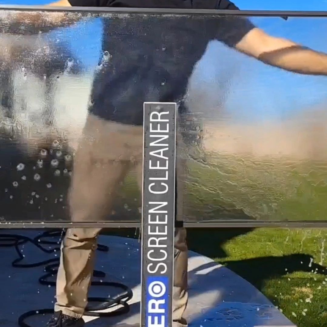 A window screen being washed